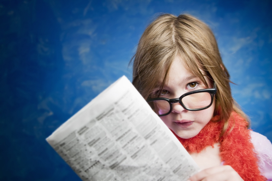 Girl With Glasses And A Newspaper Girl Reading