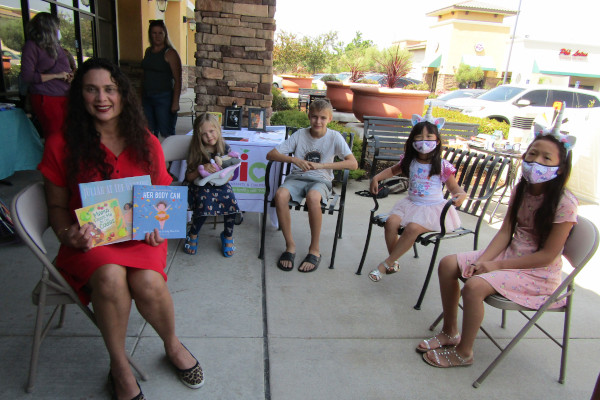 Mayor Bobbie Singh-Allen Reads To Kids At A Seat At The Table Books Pop-Up